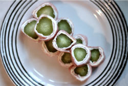 Image of pickle sushi stacked in a pyramid shape.